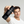 Person holding a black bottle labeled 'MR. JONES Conditioner' against a plain background