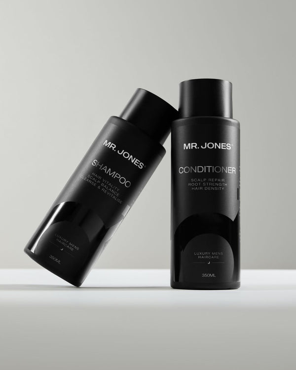 Two black bottles labelled as Mr Jones Shampoo and Conditioner