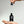 Hand holding a dropper bottle of Mr. Jones Beard Serum with a grey background